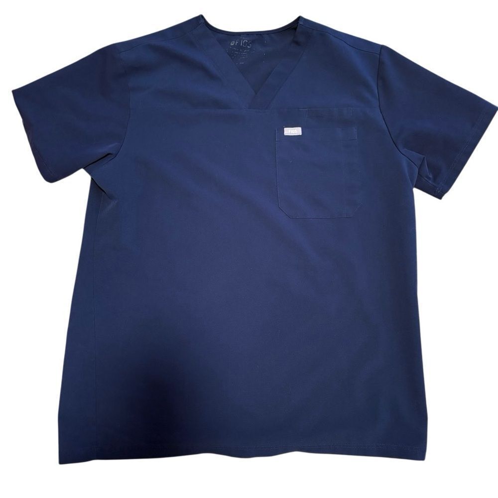 Figs Blue Scrub Shirt. Measurement are the same as a Medium. See Pictures.